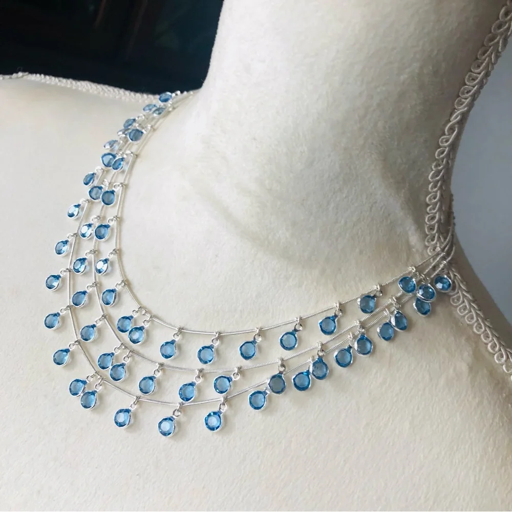 Vintage Anne Klein lion triple strand framed blue crystal dangle necklace